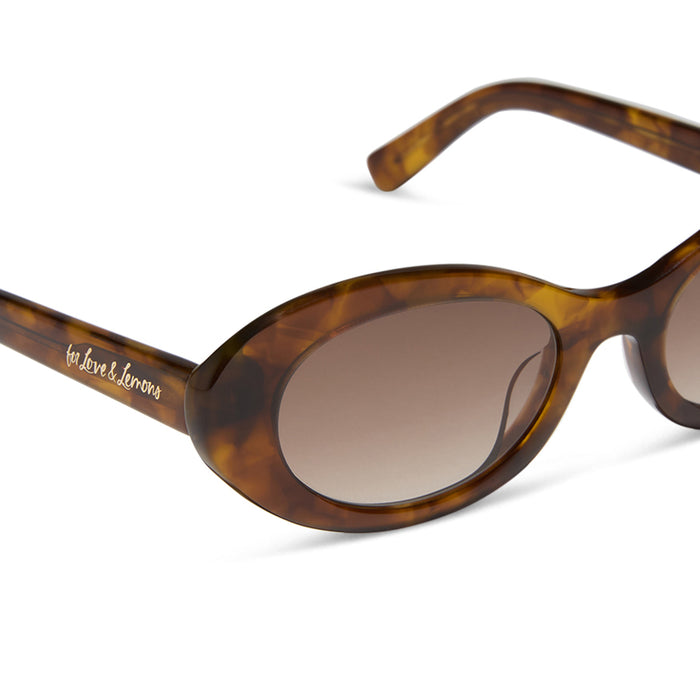 for love & lemons x diff eyewear featuring the sabrina oval sunglasses with a honey tortoise acetate frame and brown gradient lenses detailed view