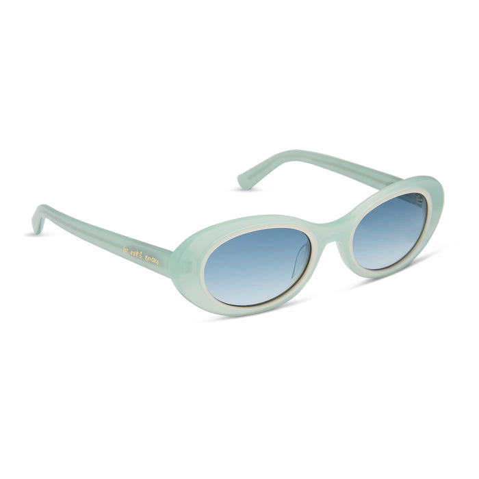 for love & lemons x diff eyewear featuring the sabrina oval sunglasses with a pastel sage acetate frame and blue gradient lenses angled view