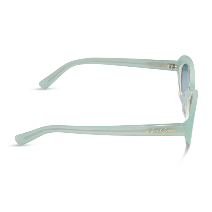 for love & lemons x diff eyewear featuring the sabrina oval sunglasses with a pastel sage acetate frame and blue gradient lenses side view