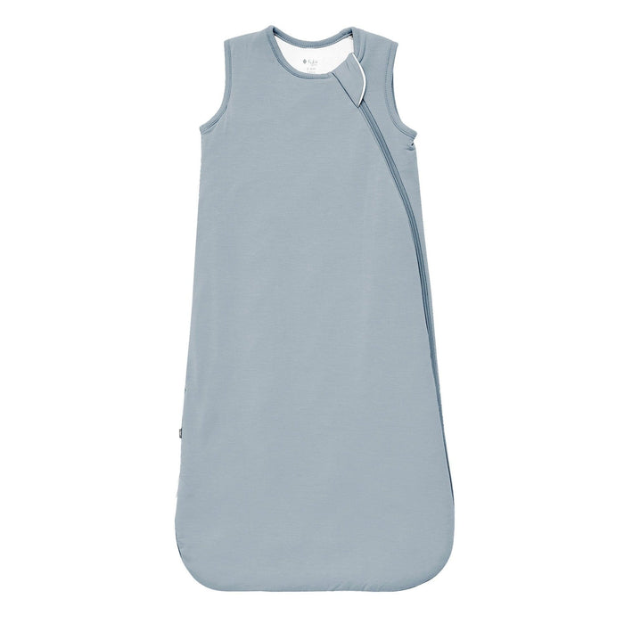 Flat lay of a Kyte Baby Sleep Bag in Fog 1.0