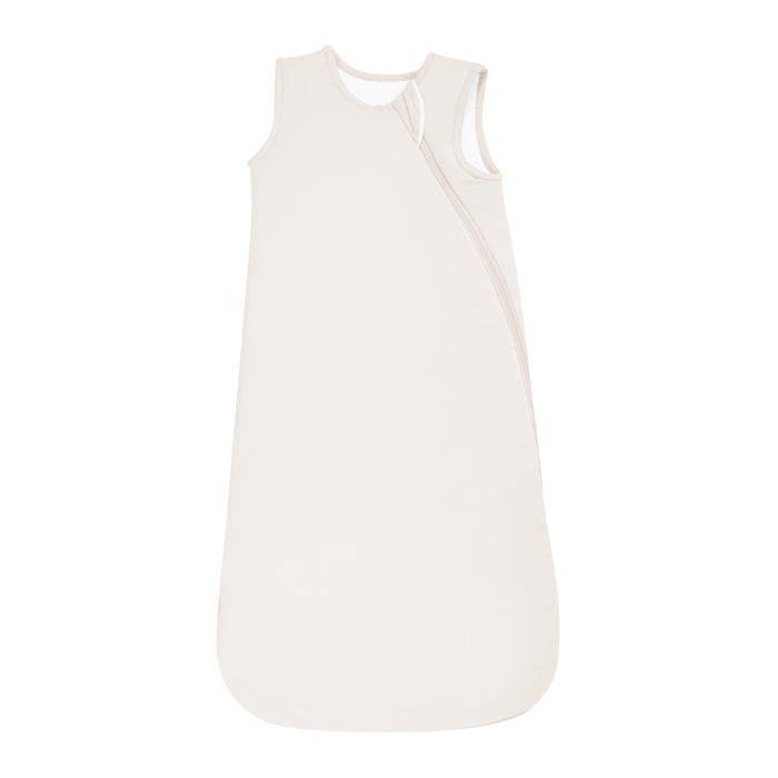 Flat lay of Kyte Baby Sleep Bag in Oat 2.5