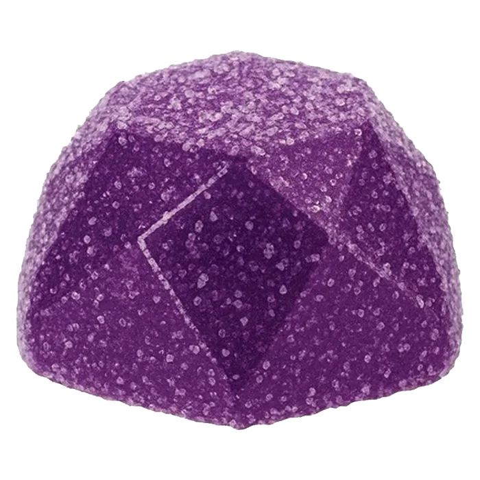 Close-up front view of a sugar-coated purple gem-shaped candy, Sour Grape Rush Gummies, on a plain white background.