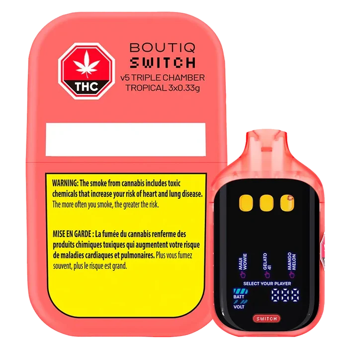 Front-facing shot of the coral-colored Boutiq Switch V5 Triple Chamber Tropical Disposable Vape and its matching case, showing the device's glossy mouthpiece, black display with three flavor icons, and the case's yellow warning panel.