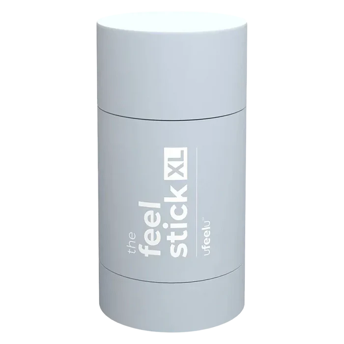 Top-down view of the pale blue cylindrical The Feel Stick XL with white vertical branding visible on its curved surface