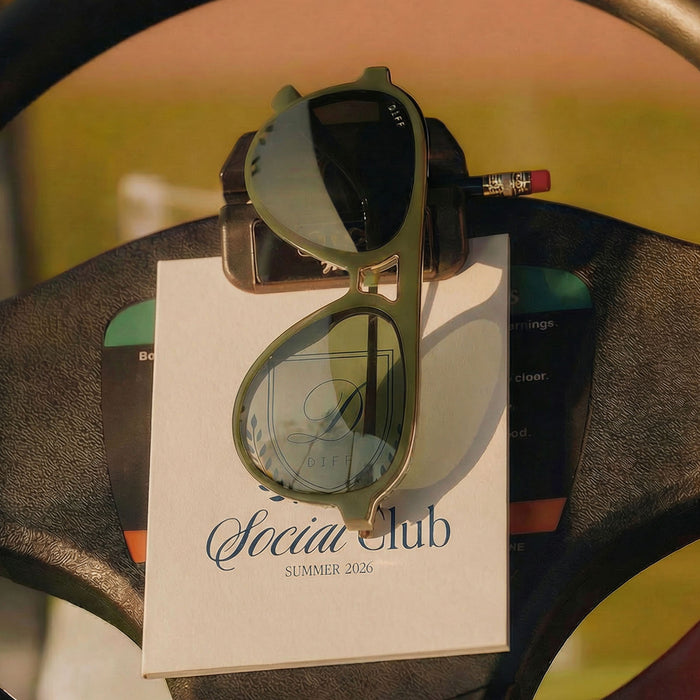 still life - diff eyewear tosca iii fairway green resting on a steering wheel of a golf cart