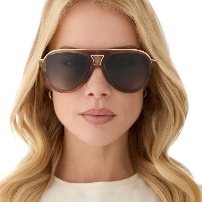 on model - female wearing diff eyewear featuring the tosca iii aviator sunglasses with a tawny brown tortoise frame and brown gradient polarized lenses front view