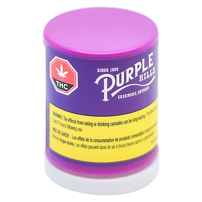 Three-quarter view of the purple and pink Tropical Twist Live Resin Badder container with a yellow warning band and THC symbol.