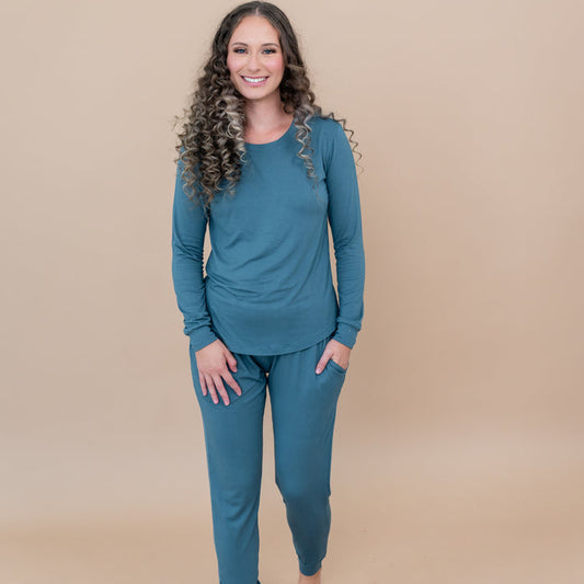 Female modeling the Women's Jogger Pajama Set in Atlantic with one hand in pants pocket
