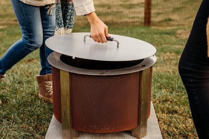 An image of an X Series Corten firepit with a lid