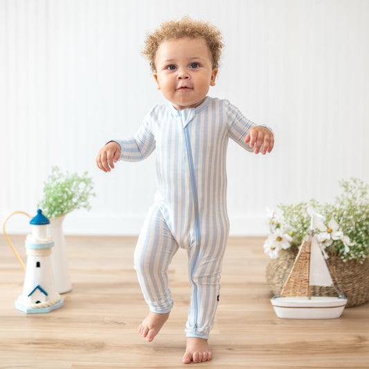 Toddler walking in the Zippered Romper in Small Mist Stripe